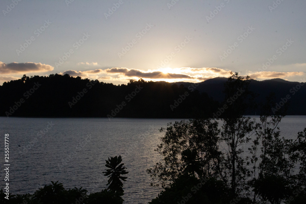 Fototapeta premium Sunsets over a tropical island