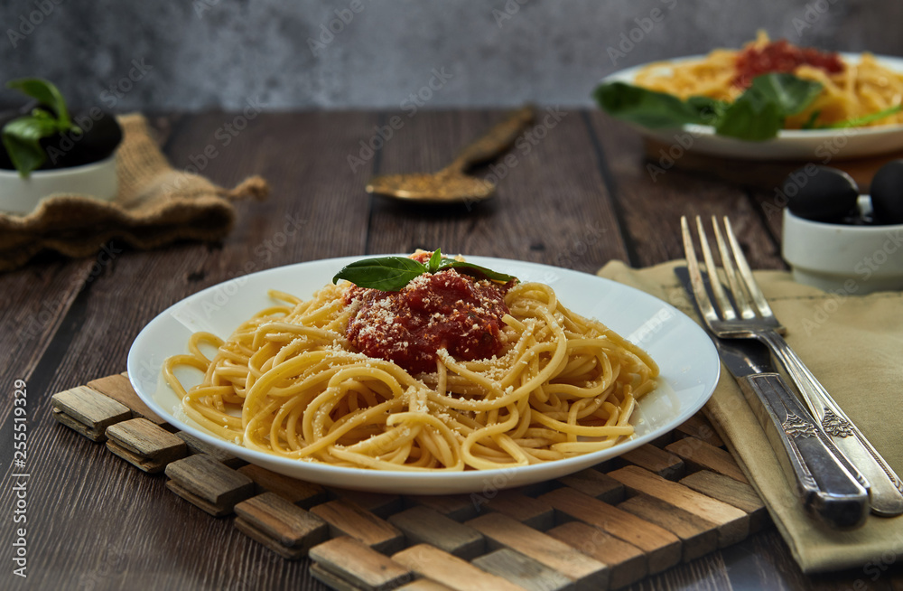 Tasty colorful appetizing cooked spaghetti italian pasta with tomato sauce bolognese and fresh basil. Tasty colorful appetizing cooked spaghetti italian pasta with tomato sauce bolognese and fresh basil.