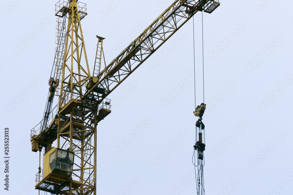 Large construction cranes working on a building complex. Space for text. Large construction cranes working on a building complex. Space for text.