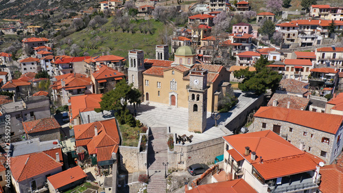 Aerial drone photo from famous and picturesque village of Arachova built on the slope of Parnassus mountain with traditional character at spring, Voiotia, Greece