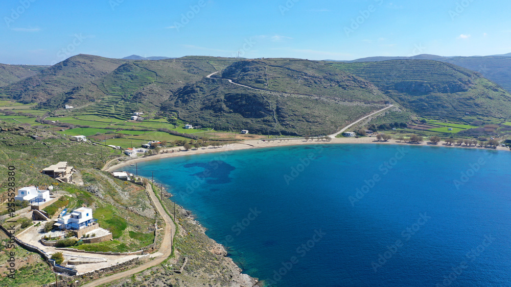 Aerial drone photo of iconic two sided sandy tropical turquoise sea paradise beach of Apokrisi near Fykiada in island of Kythnos at spring, Cyclades, Greece