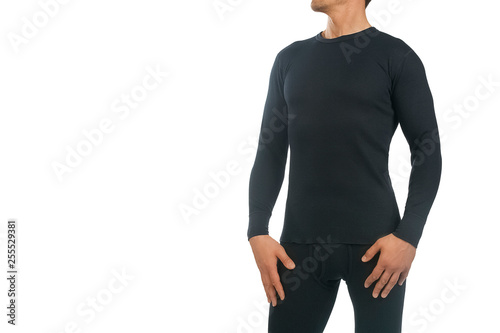 Man in thermal underwear for active winter sport. Man wearing Thermolinen isolated on white background. T-shirt with long sleeves and leggings