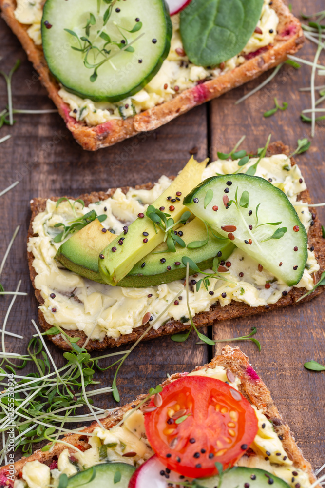 Sandwiches with cream cheese, vegetables and salami. Sandwiches with cream cheese, vegetables and salami.