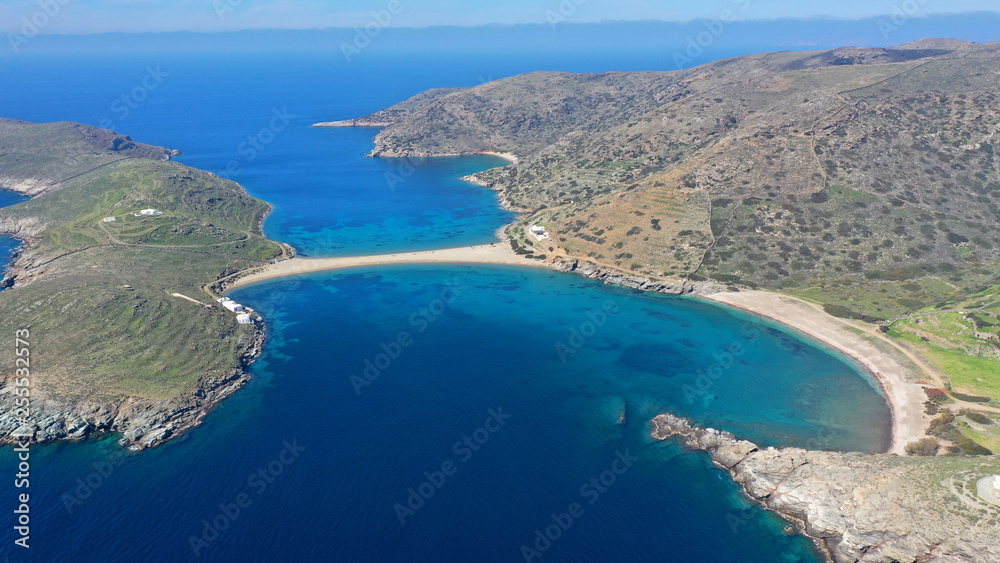 Aerial drone panoramic photo of iconic two sided sandy tropical turquoise sea paradise beach of Kolones near Fykiada in island of Kythnos at spring, Cyclades, Greece