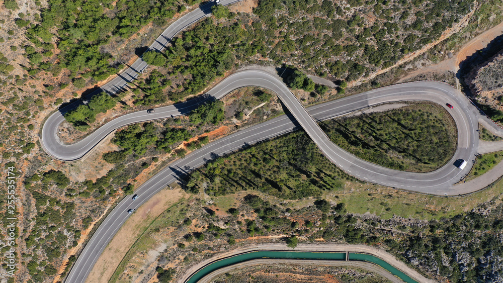 Aerial drone top view photo of snake curvy road built in steep mountain slope Aerial drone top view photo of snake curvy road built in steep mountain slope