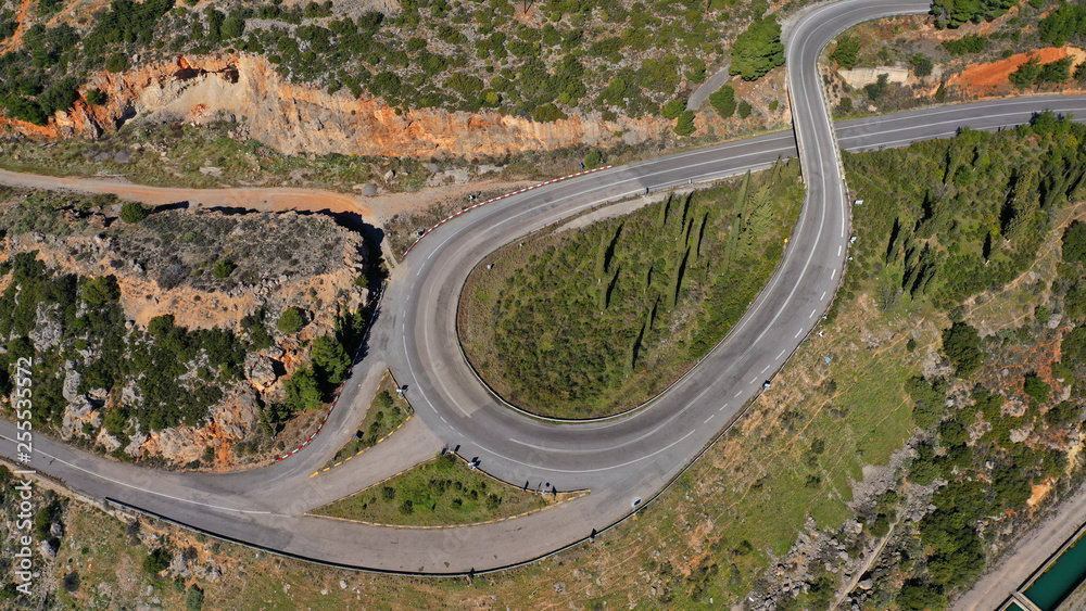 Aerial drone top view photo of snake curvy winding road built in steep mountain slope
