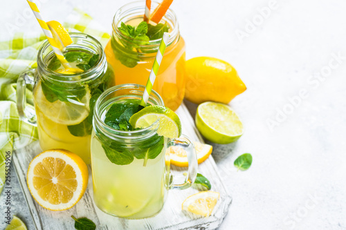 Lemonade, mojito and orange lemonade on white.