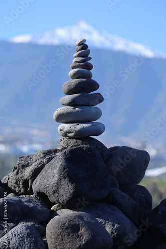 Stacked stone pyramid in front of the teide volcano  tenerife  spain