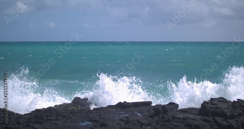 Waves Crashing in Behind Volcanic Rock in Hawaii