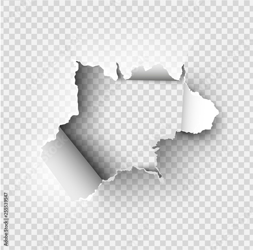 ragged Hole torn in ripped paper on transparent