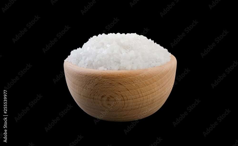 white salt crystals in wooden bowl isolated on white background. Spices and food ingredients.