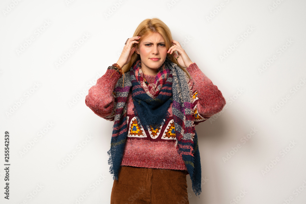 Hippie woman over white wall unhappy and frustrated with something Hippie woman over white wall unhappy and frustrated with something