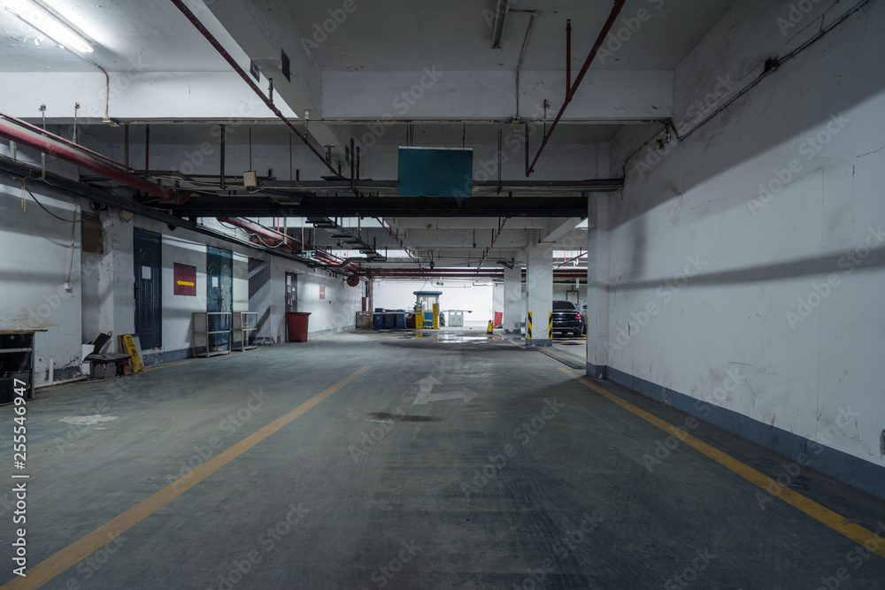 old parking lot with lighting, concrete building