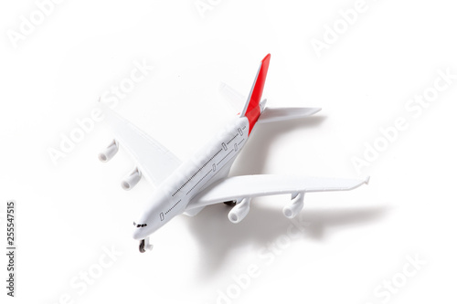 Toy airplane isolated on white. Travel and technology concept