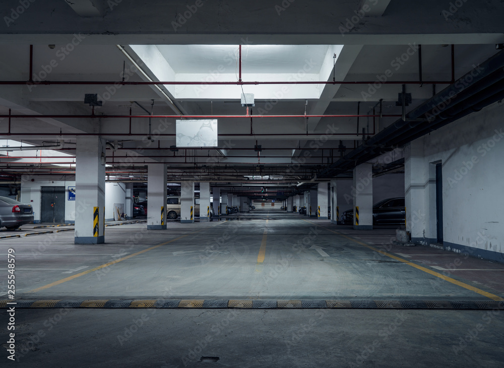 old parking lot with lighting, concrete building