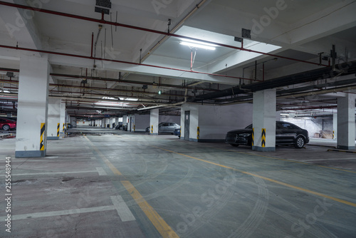 old parking lot with lighting, concrete building © Vink Fan