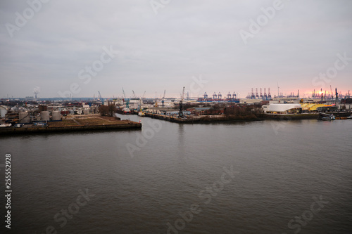 Hamburg Harbor with beautiful sunset and loading cranes © Sebastian