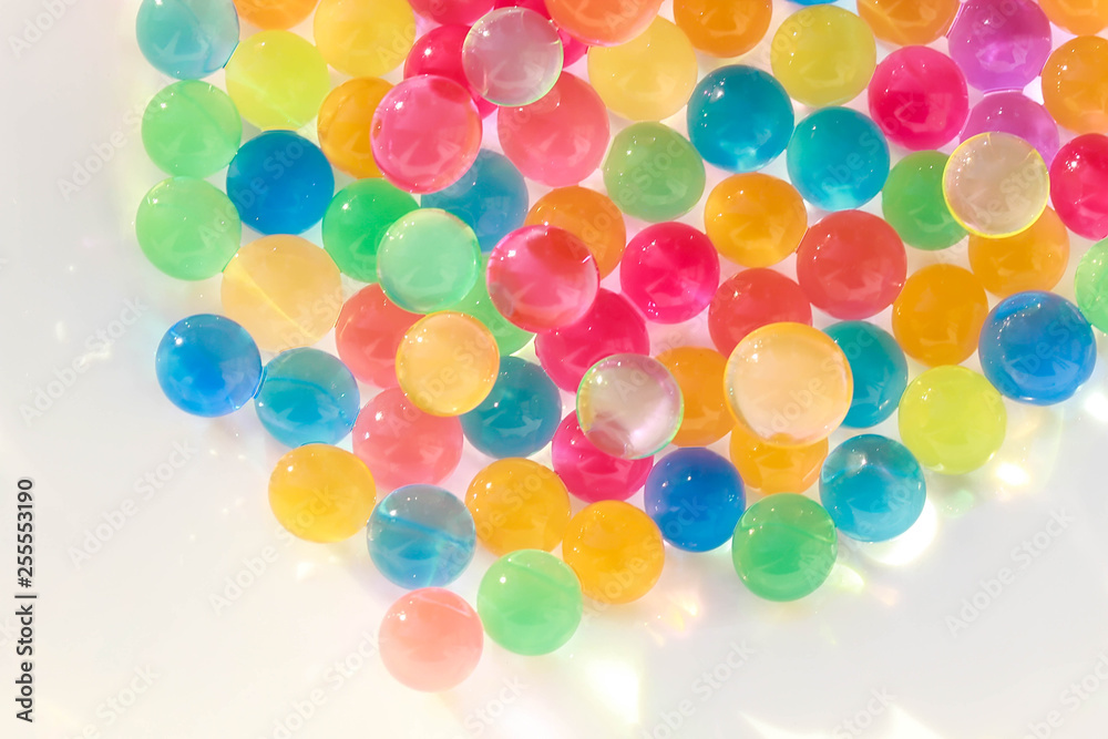 Water coloured gel balls. Polymer gel. Silica gel. Balls of blue hydrogel. Crystal liquid ball with reflection. Texture background. Close up macro Water coloured gel balls. Polymer gel. Silica gel. Balls of blue hydrogel. Crystal liquid ball with reflection. Texture background. Close up macro