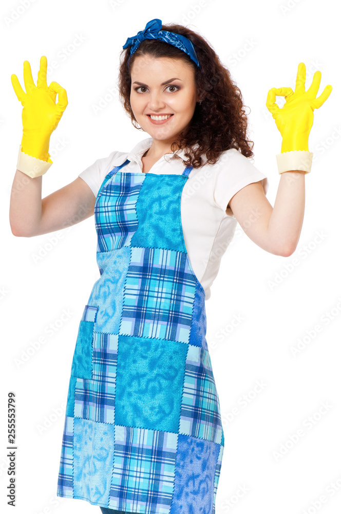 Beautiful young housewife with yellow latex cleaning gloves. Young happy woman put on hand yellow rubber glove, looking at camera and doing a ok gesture, isolated on white background. Beautiful young housewife with yellow latex cleaning gloves. Young happy woman put on hand yellow rubber glove, looking at camera and doing a ok gesture, isolated on white background.