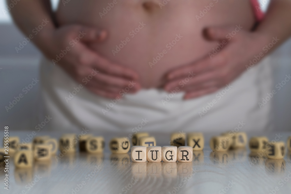 Φωτογραφία Abbreviation IUGR for intrauterine growth restriction composed of wooden letters