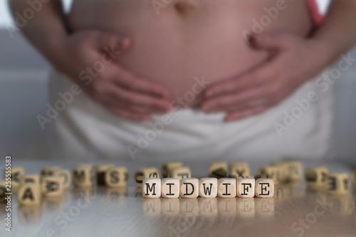 Word MIDWIFE composed of wooden letters.