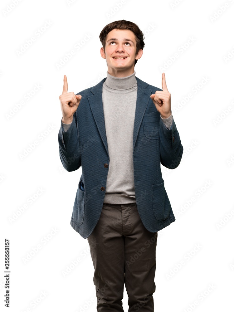 Teenager man with turtleneck pointing up and surprised over isolated white background Teenager man with turtleneck pointing up and surprised over isolated white background