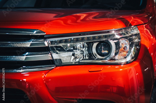 modern ice headlight red car close up © kamaz007