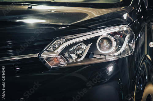 modern ice headlight black car close up
