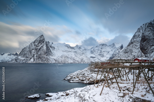 Fotografie Hamnoy village during a winter with stockfish drying on wooden racks, Lofoten Is