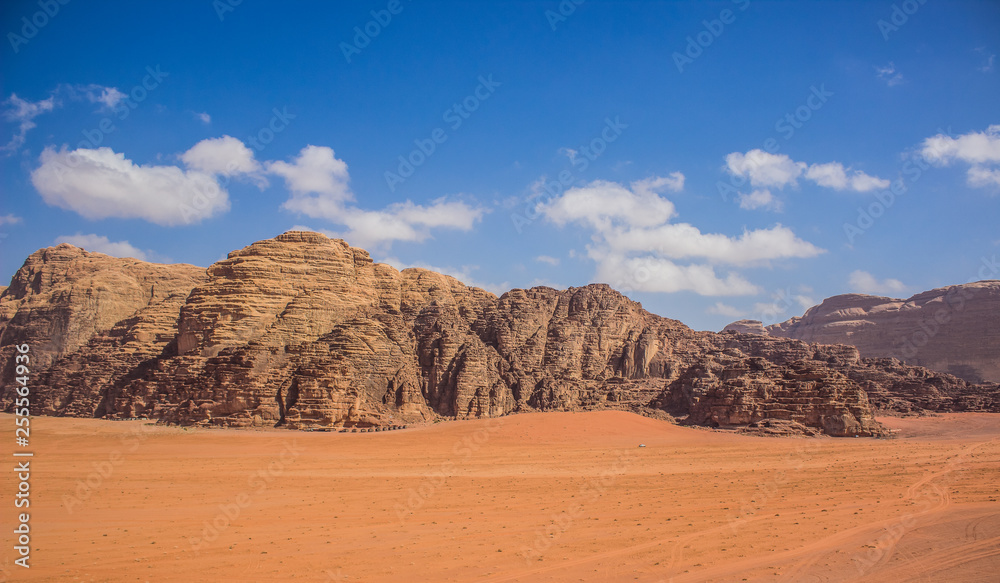 Wadi Rum rocks bare mountain ridge Jordanian desert panorama scenery  landscape travel and touristic photography Stock Photo | Adobe Stock