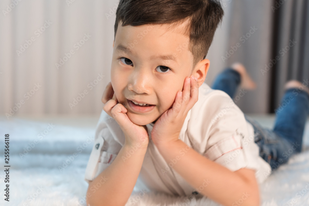 portrait of happy little boy on bed portrait of happy little boy on bed