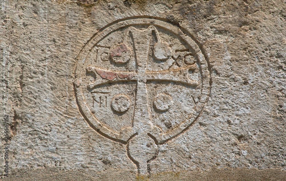Cross carved in stone on wall at temple Canaanite in new athos, abkhazia