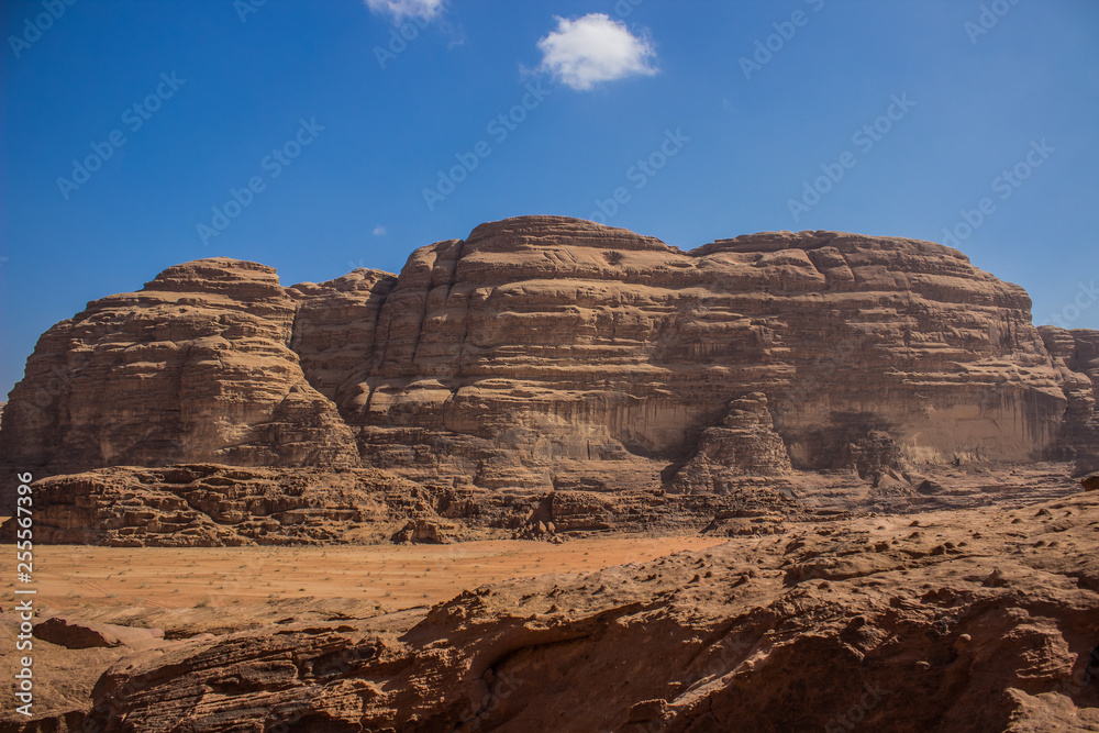 Middle East picturesque bare mountain ridge and big sand valley desert scenery landscape travel photography 