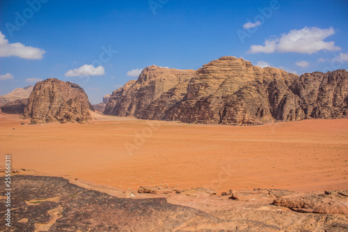 Middle East picturesque bare mountain ridge and big sand valley desert scenery landscape travel photography 