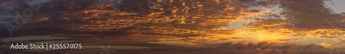 panoramic view of dramatic orange clouds at sunrise