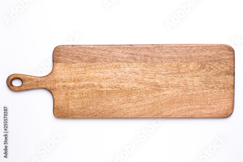 Wooden long kitchen board on a white background top view