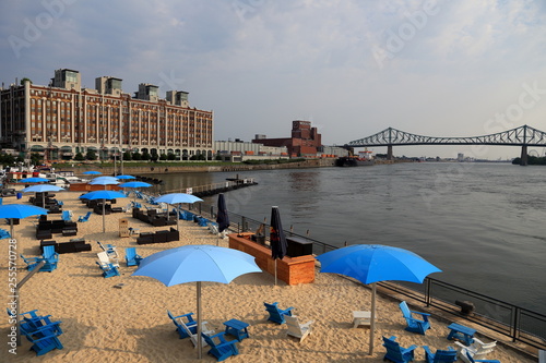 View of Old Montreal's beach, buildings, St. Lawrence River and Jacques Cartier bridge, Montreal, Quebec, Canada