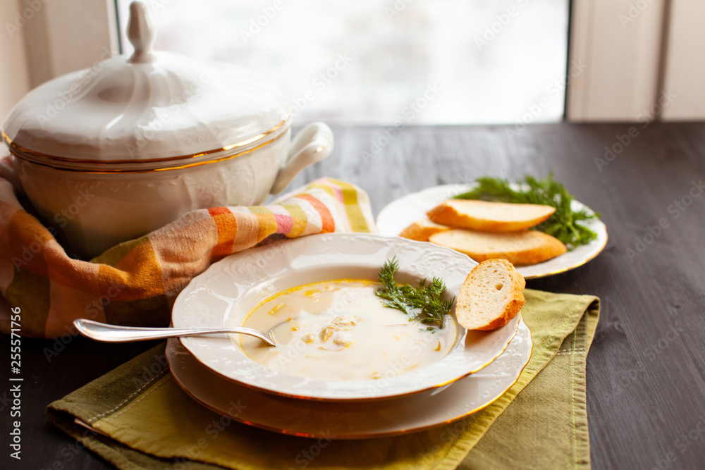 Creamy fish soup with salmon, potatoes and dill