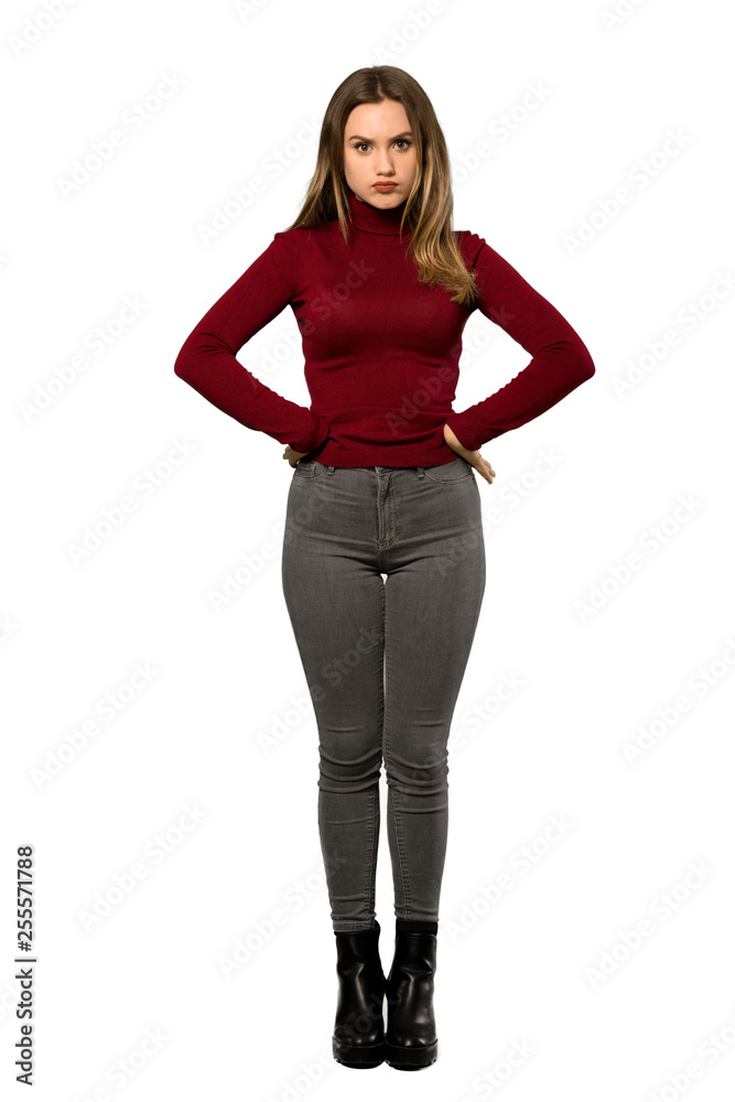 A full-length shot of a Teenager girl with turtleneck angry over isolated white background A full-length shot of a Teenager girl with turtleneck angry over isolated white background