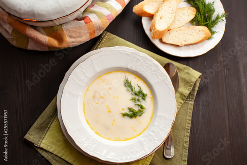 Creamy fish soup with salmon, potatoes, onions and carrots