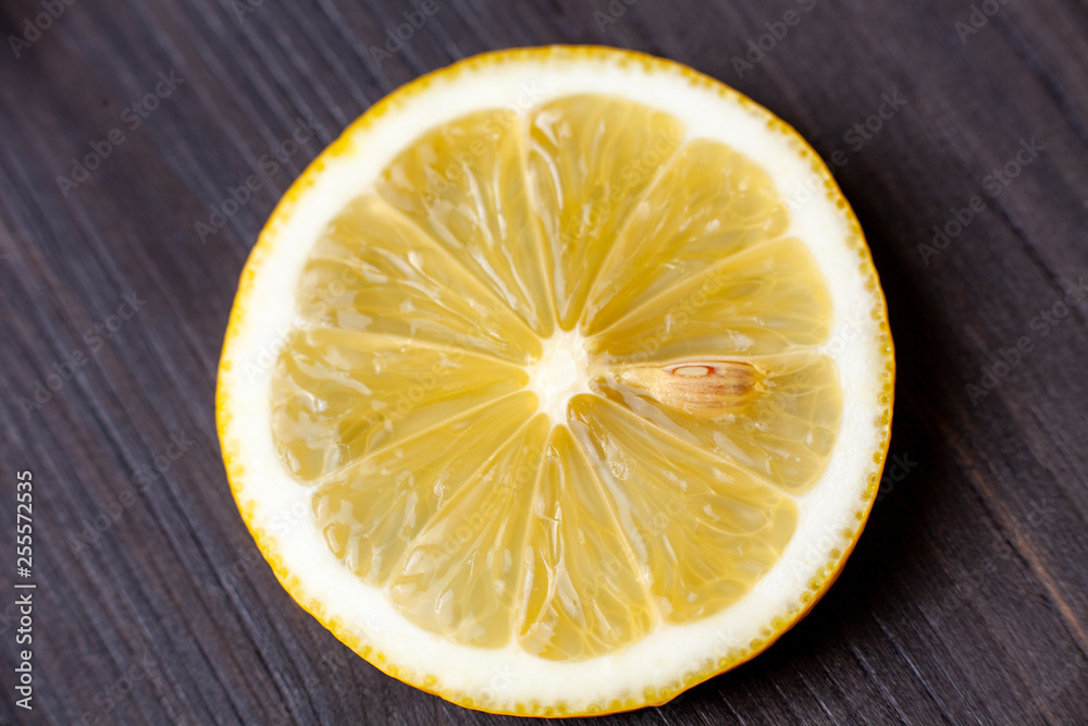 A slice of lemon close up, top view A slice of lemon close up, top view