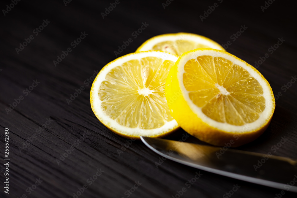 Sliced lemon on dark background close up Sliced lemon on dark background close up