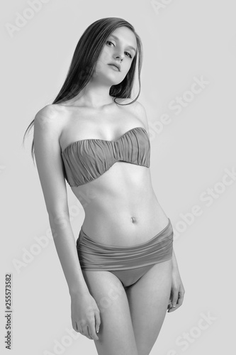 Slim body of young woman in bikini on white . Girl with healthy sporty figure © zhagunov_a