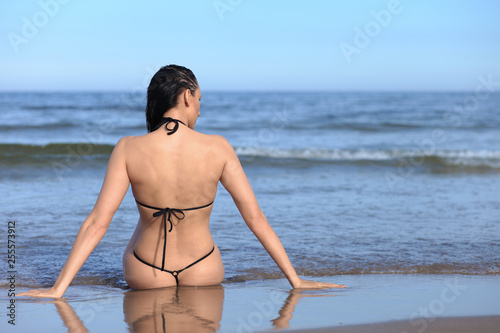 woman with sporty body in bikini