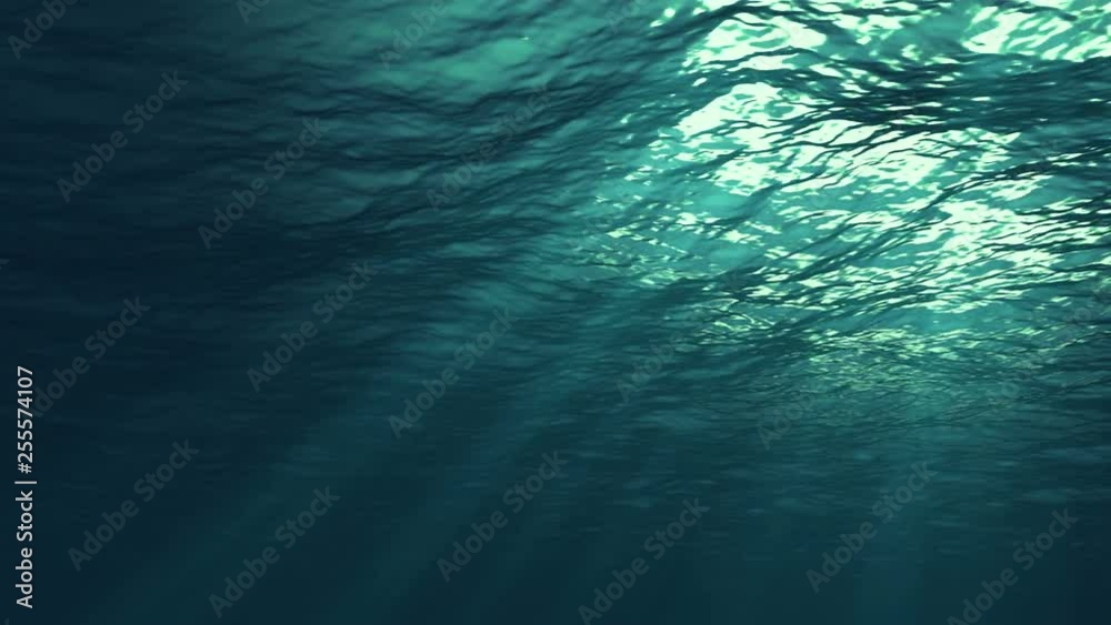 Underwater light creates a beautiful veil, consisting of sunlight. Underwater ocean waves oscillate and flow with the rays of light