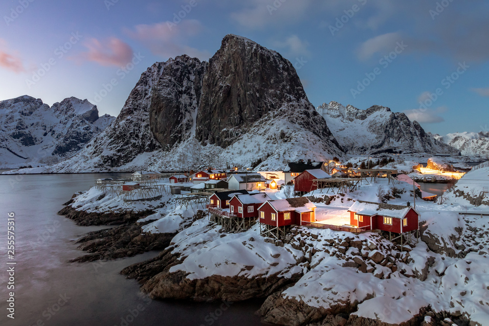 The beautiful Hamnoy Rorbuer at the Lofoten Islands in Norway in winter and in dusk