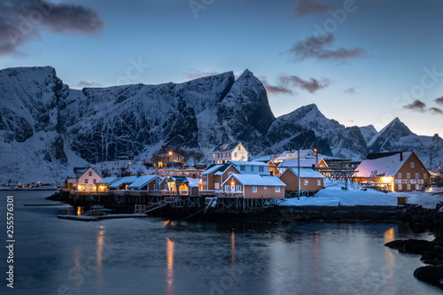 The beautiful Sakrisoy Rorbuer at the Lofoten Islands in Norway in winter and in dusk © Nils