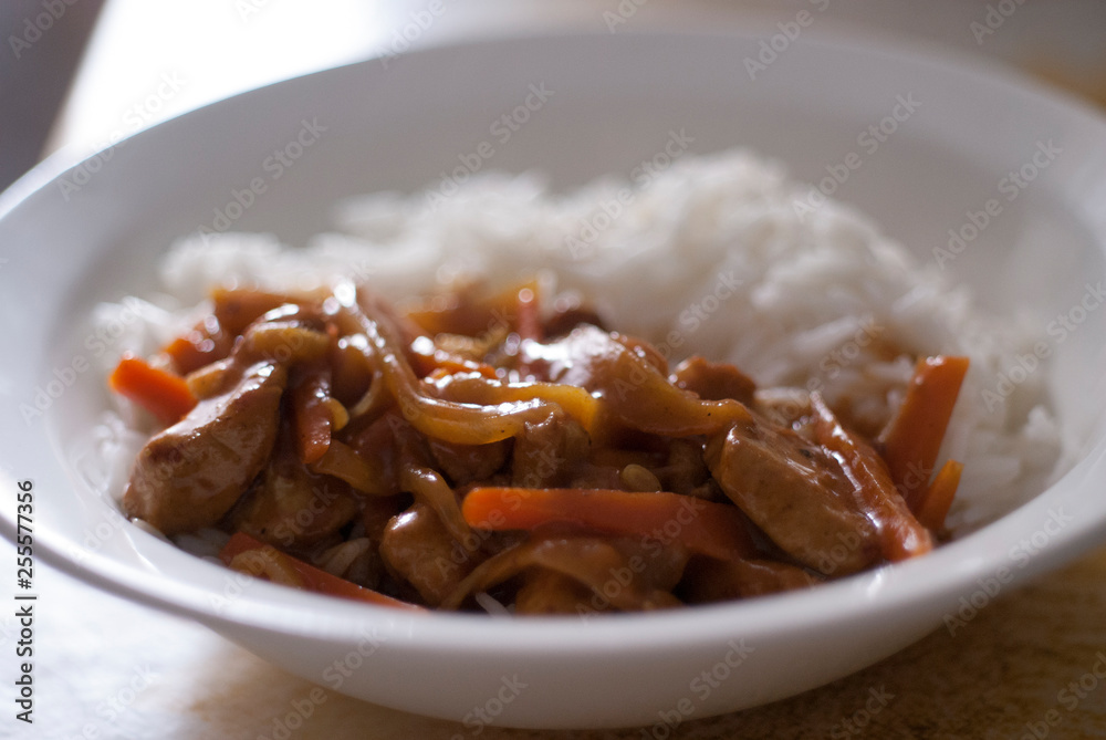 Tasty Beef Stroganoff and rice on white plate Tasty Beef Stroganoff and rice on white plate