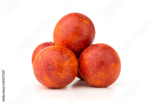 Bloody orange on a white background. Several red orange close-up on a white background.