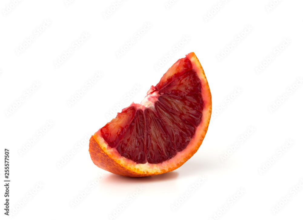 Bloody orange on a white background. A slice of red orange on a white background. Bloody orange on a white background. A slice of red orange on a white background.